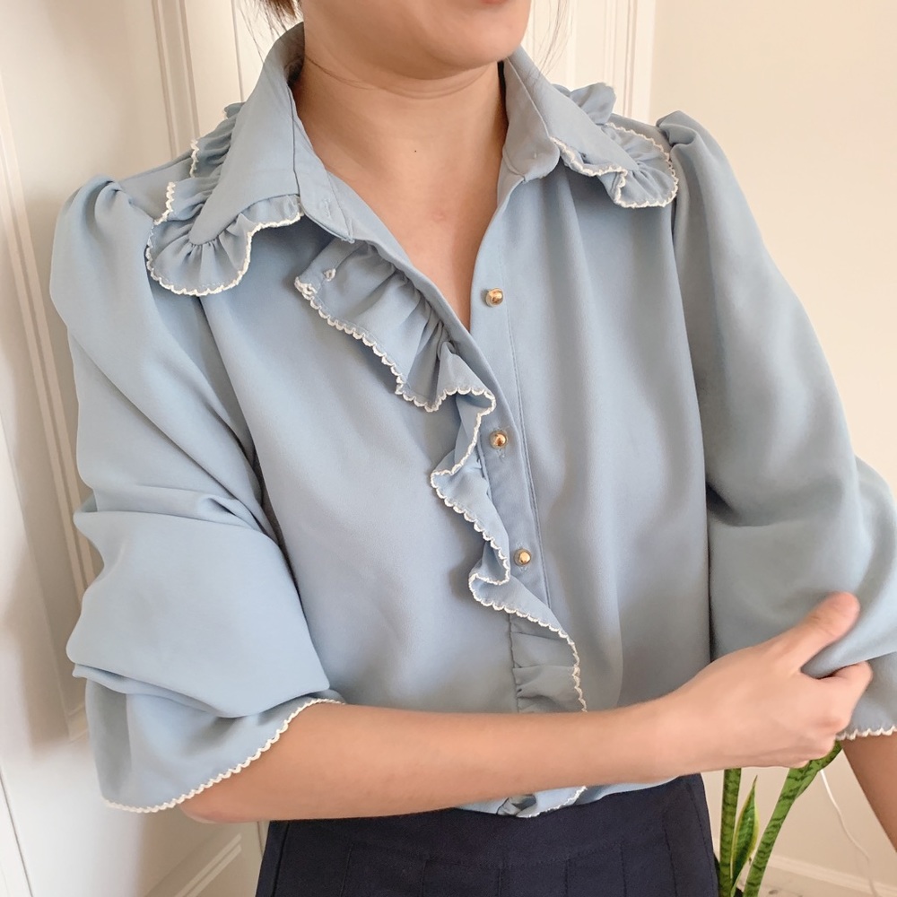 Sky blue blouse with ruffle details